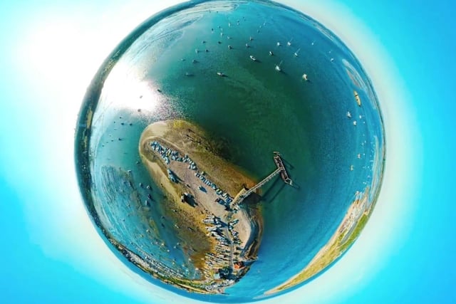 A globe photograph taken 200 ft over Langstone harbour near the Hayling ferry.