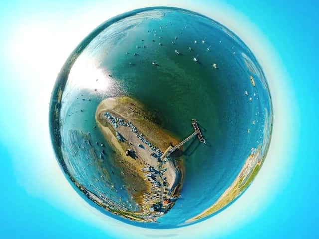A globe photograph taken 200 ft over Langstone harbour near the Hayling ferry.