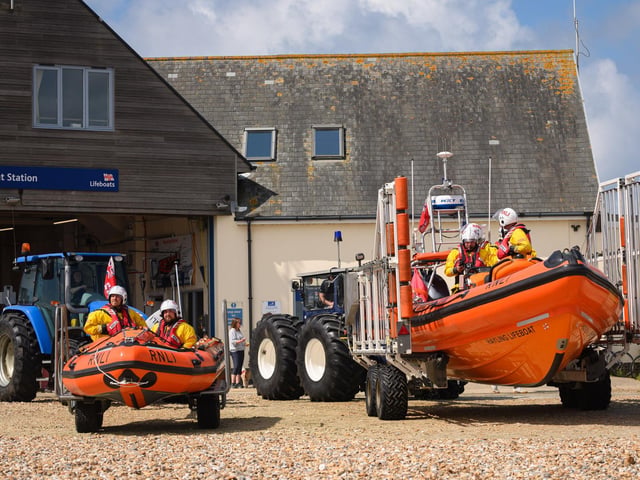 Pictured is: The lifeboats are pushed down the beachPicture: Keith Woodland (260521-31)