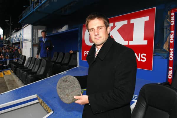 In an emotional tribute, Jimmy Ball lays father Alan's famous flat cap on the roof of the Fratton Park players' tunnel before the encounter with Arsenal in May 2007. Picture: Steve Reid