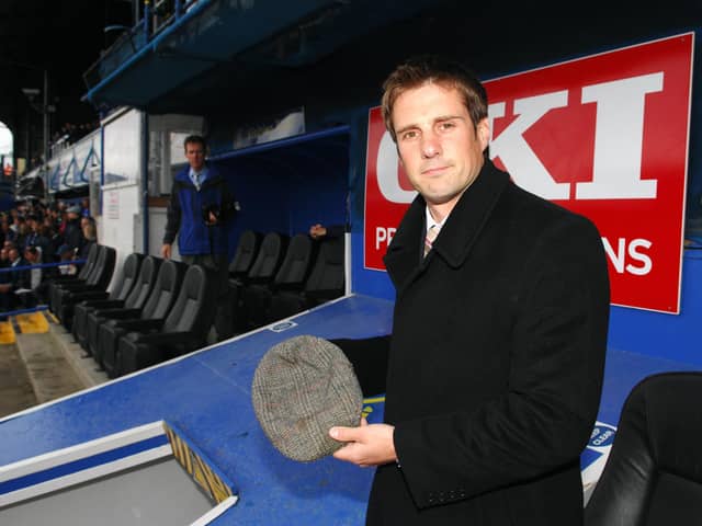 In an emotional tribute, Jimmy Ball lays father Alan's famous flat cap on the roof of the Fratton Park players' tunnel before the encounter with Arsenal in May 2007. Picture: Steve Reid