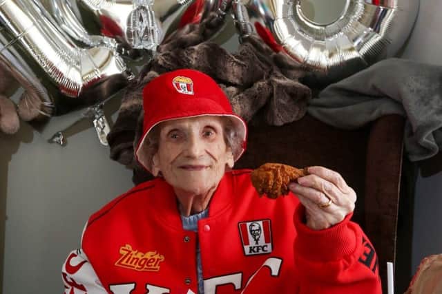 Eileen Veysey celebrates her 103rd birthday with a bucket of fried chicken.