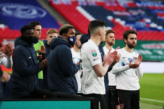 Pompey applaud Salford as they lift the Papa John's Trophy following their victory on penalties at Wembley. Picture: Joe Pepler