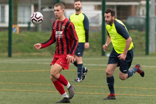 Horndean (red/black) v Harvest in Mid-Solent League action in 2019/20. Picture: Keith Woodland