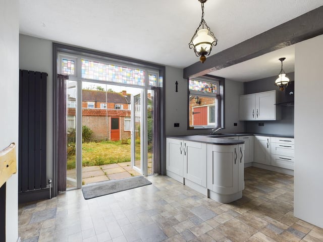 The kitchen leads into the garden
