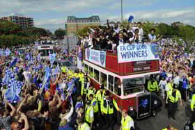 Fans celebrate with the players at the FA Cup Pompey parade. Picture: Malcolm Wells 082235-5585