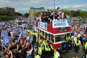 Fans celebrate with the players at the FA Cup Pompey parade. Picture: Malcolm Wells 082235-5585