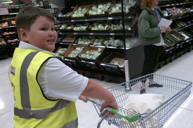 Albie Hodder is selling baked goods at school o raise cash for Autism Hampshire.