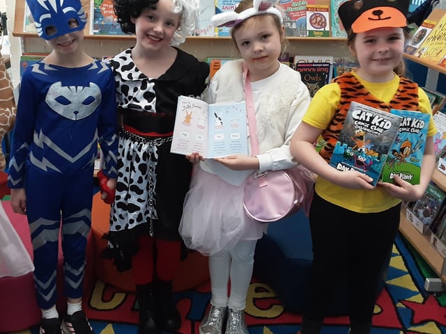 Children & staff from Solent Infant School dressed up for World Book Day.  Pictured: (From left to right): Lottie, Darcy, Orla and Jessica