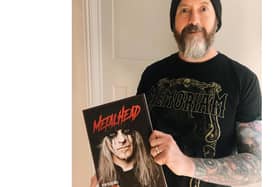 Highbury College tutor Darren Salder holding the first edition of Metalhead Magazine.