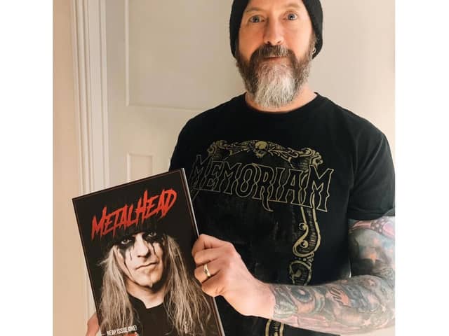 Highbury College tutor Darren Salder holding the first edition of Metalhead Magazine.