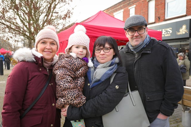From left, Maria Doran, Sadie Clarke holding Alice, 4, and Liam Clarke. Waterlooville Christmas market 
Picture: Chris Moorhouse