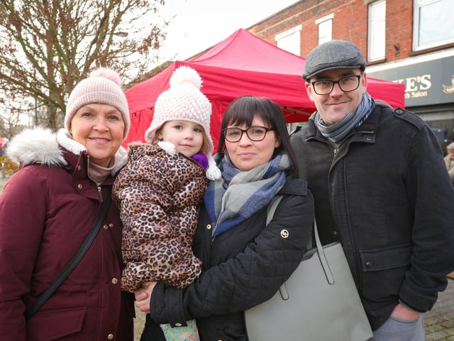 From left, Maria Doran, Sadie Clarke holding Alice, 4, and Liam Clarke. Waterlooville Christmas market 
Picture: Chris Moorhouse