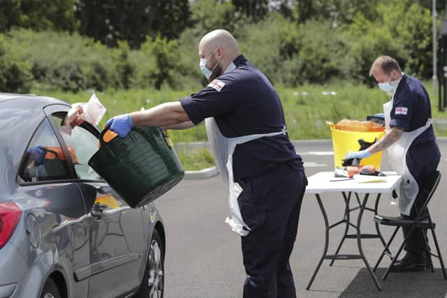 Pictured: Royal Navy personnel from HMS Prince of Wales operate a Mobile Testing Unit in Hampshire in July 2020.