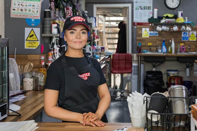 Beth Hills (20) - daughter of the owner Sue Hills - ready to take orders at the Whistlestop Café. Picture: Mike Cooter (150721)