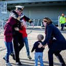 Commanding Officer Captain Richard Hewitt OBE greets his wife Clara his children Oliver, 10, William, eight and Ben two.