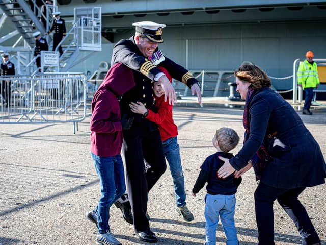 Commanding Officer Captain Richard Hewitt OBE greets his wife Clara his children Oliver, 10, William, eight and Ben two.