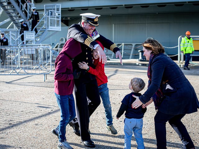 Commanding Officer Captain Richard Hewitt OBE greets his wife Clara his children Oliver, 10, William, eight and Ben two.