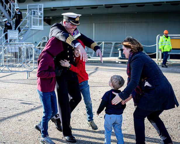 Commanding Officer Captain Richard Hewitt OBE greets his wife Clara his children Oliver, 10, William, eight and Ben two.