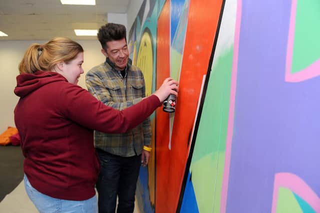 Portsmouth artist 'Fark' with Taylor Sambrook (26). Picture: Sarah Standing (090320-6751)