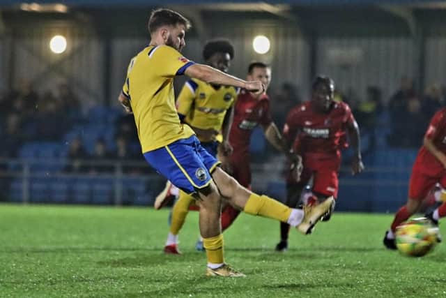 Harvey Rew converts his penalty against Harrow last night. Picture by Tom Phillips