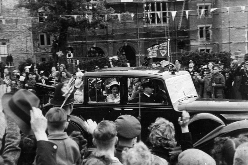Royals King George VI with the Queen Mother and Princesses Elizabeth and Margaret Rose passing the war-damaged Lower School at Portsmouth Grammar School in 1947. The News PP756