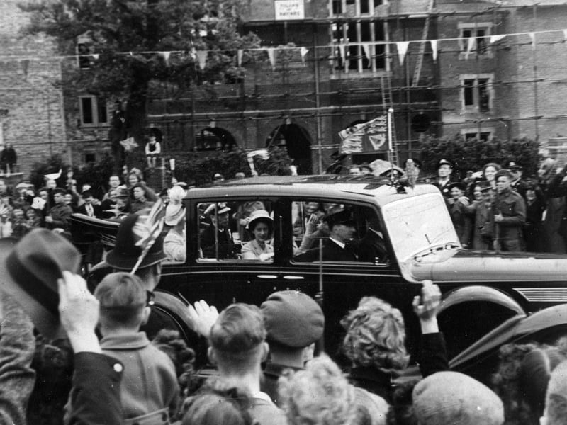 Royals King George VI with the Queen Mother and Princesses Elizabeth and Margaret Rose passing the war-damaged Lower School at Portsmouth Grammar School in 1947. The News PP756