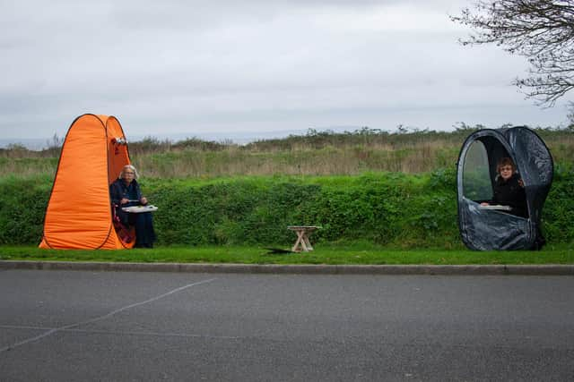 Angela Barnes and her friend Janice Burkinshaw are both widows who have supported each other through the Covid restrictions. As they can no longer enjoy Sunday dinner in Janice's garden they bought pop-up pods which they put up on Milton Common to enjoy a 2-course dinner

Pictured: Angela Barnes and her friend Janice Burkinshaw having their meal in Milton Common,  Portsmouth on 11 November 2020.

Picture: Habibur Rahman