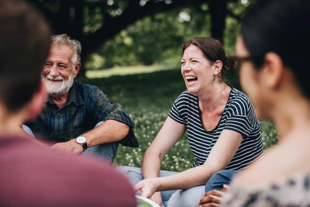 The simple joy of meeting friends and talking outdoors. Picture by Shutterstock