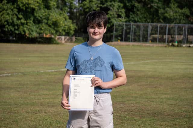Headteacher's Cup Award Winner, Reuben, pictured with his results at Boundary Oak School.