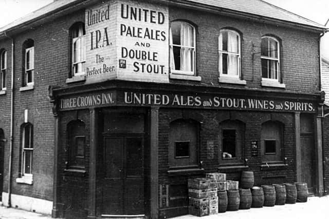 Dressed for wartime service with blackouts in the windows, this is the Three Crowns in St James' Street, Portsea.