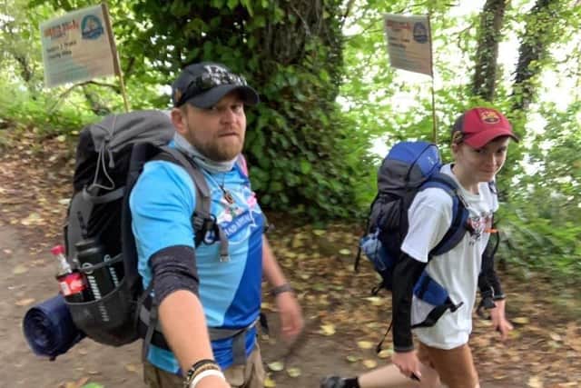 Chief Petty Officer (Electronic Warfare) Chris Levy and his retired colleague Petty Officer (Electronic Warfare) Simon Cranfield set off from HMS Nelson for a 200-mile trek for Royal Navy and Royal Marines Charity and Bristol Children's Hospital. Pictured: Chris Levy with his son Harrison, 14, training for the trek
