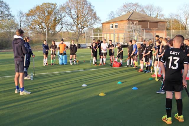 Fareham's junior section players take on information from England aces Lily Owlsey and Ollie Willars