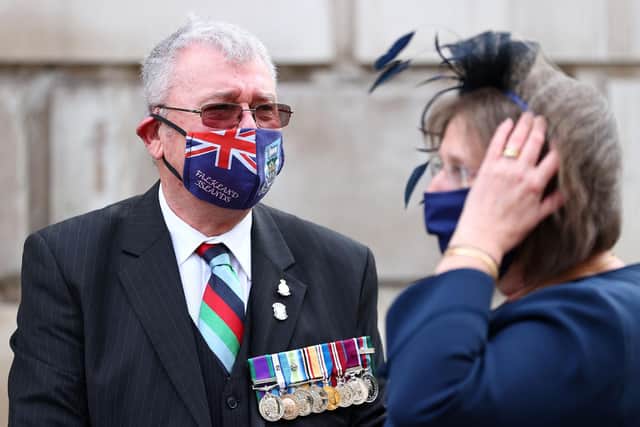 Attendees arrive for a Service of Remembrance to mark the 40th anniversary of the Falklands conflict, at St Paul's Cathedral in central London. Photo by ADRIAN DENNIS/AFP via Getty Images.