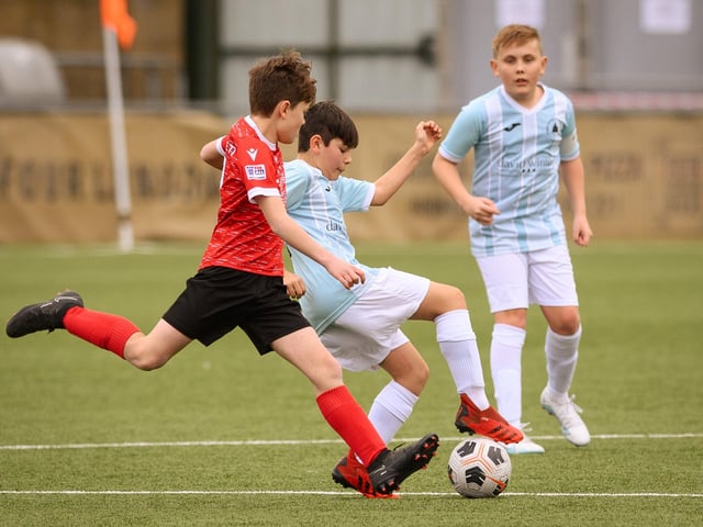 Action from the Portsmouth Youth League Geldard Invitation Cup final between Jubilee 77 U13s and Castle United U13s (light blue and white kit). Picture: Keith Woodland (190321-555)