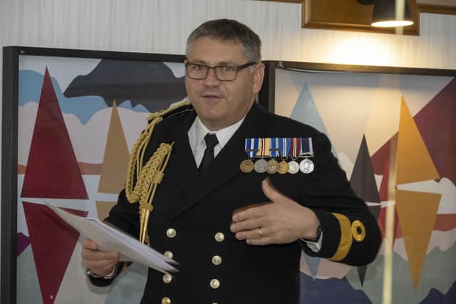 Commodore Jeremy Bailey reading the letter from the First Sea Lord at Howard Stowell's 100th birthday party. Picture: Nigel Standerline/Streten Photographers.