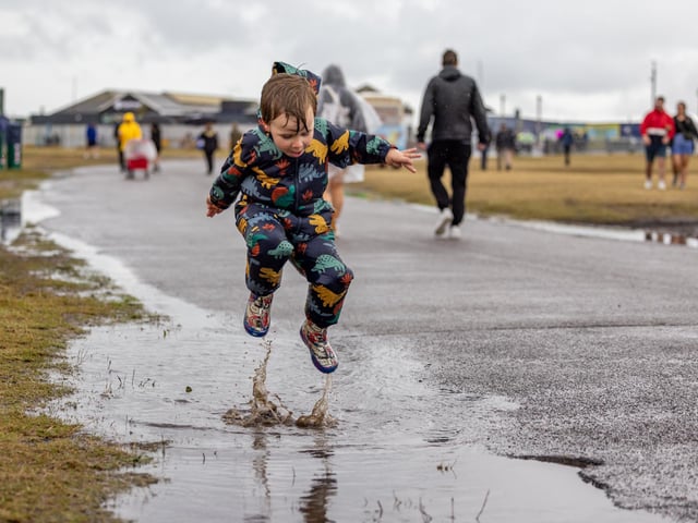 Louis Charley (4) from Portsmouth making full use of the puddles on site at Victorious. Picture: Mike Cooter (240824)