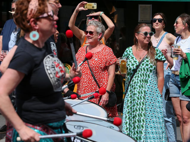Watching Batala. Ports Fest mardi gras parade, Albert Road, Southsea
Picture: Chris Moorhouse (290624-265)