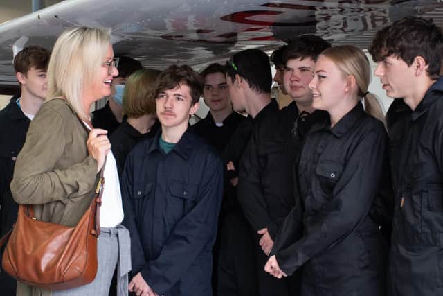 Caroline Dineage MP with Fareham College students who study Level 2 Diploma in Aerospace and Aviation Engineering and Level 3 Extended Diploma in Aeronautical Engineering at Fareham College’s CEMAST campus.