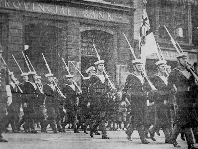In 1939  the King’s Colour was marched through Portsmouth from HMS Excellent,Whale Island to the  Royal Naval Barracks, Queen Street.