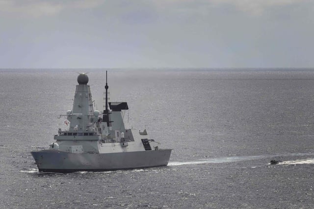 HMS Dauntless prepares to recover her sea boat during a narcotics bust in the Eastern Caribbean.