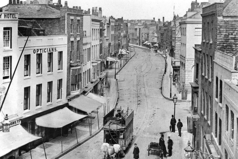 This wonderful shot was taken from the top of the Square Tower. High Street, Old Portsmouth as it looked before the Luftwaffe took its toll.
 In fact it is taken before the Great War. All the buildings on the left were destroyed and is now part of Cathedral Green.
The clocktower of the cathedral can be seen peeking over the rooftops, top left.