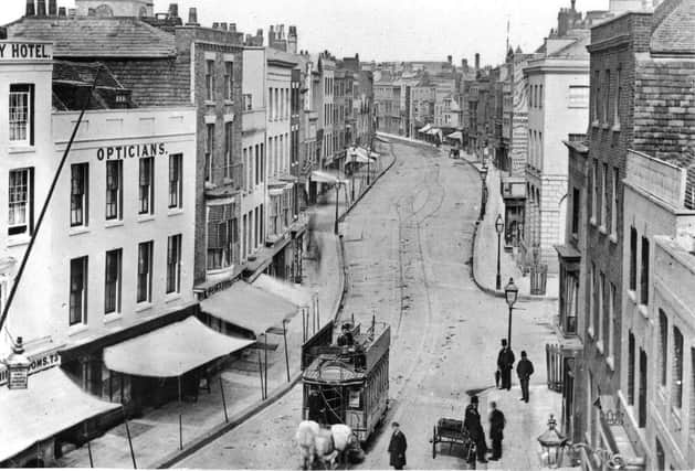 This wonderful shot was taken from the top of the Square Tower. High Street, Old Portsmouth as it looked before the Luftwaffe took its toll.
 In fact it is taken before the Great War. All the buildings on the left were destroyed and is now part of Cathedral Green.
The clocktower of the cathedral can be seen peeking over the rooftops, top left.