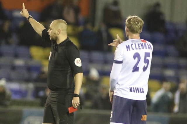 George McLennan is shown a straight red card