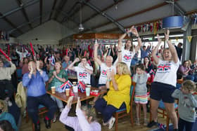 Family and friends of Olympic medal hopeful Eilidh McIntyre celebrate at Hayling Island Sailing Club Picture: Steve Parsons/PA Wire