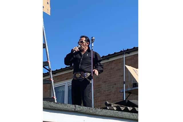 Elvis tribute artist Kevin Wright from Warren Park performed a rooftop gig to entertain his neighbours