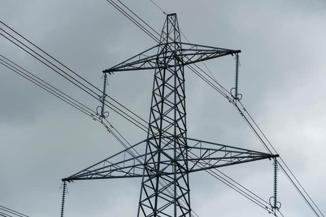 File photo dated 11/10/21 of a view of an electricity pylon in Cheshire, as Britain's electricity supply might be tight at times this winter, the body that is tasked with balancing the grid has said.