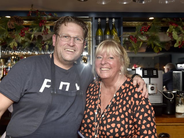 The annual Christmas lunch for OAPs at the White Hart pub in Denmead on Tuesday, December 5, 2023.Pictured is: Chris Warren with landlady Julie Burridge.Picture: Sarah Standing (051223-3158)
