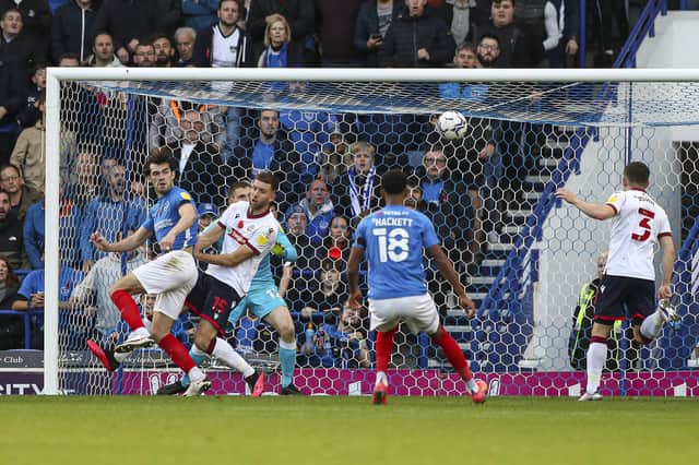 John Marquis diverts Ronan Curtis' cross past Bolton's keeper in Saturday's 1-0 Pompey win. Picture: Kieran Cleeves/PA Wire