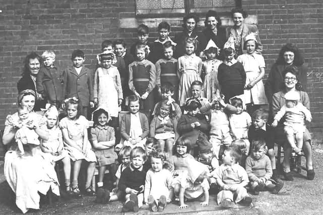 Children and parents pose for a VE Day street party in Seaview, Stamshaw, a road now under the Rudmore roundabout.